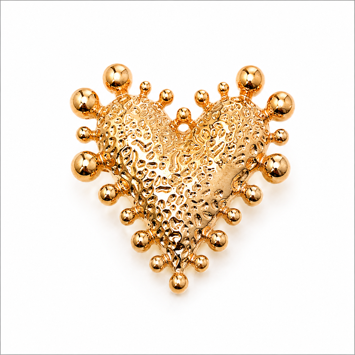 Golden heart-shaped button cover