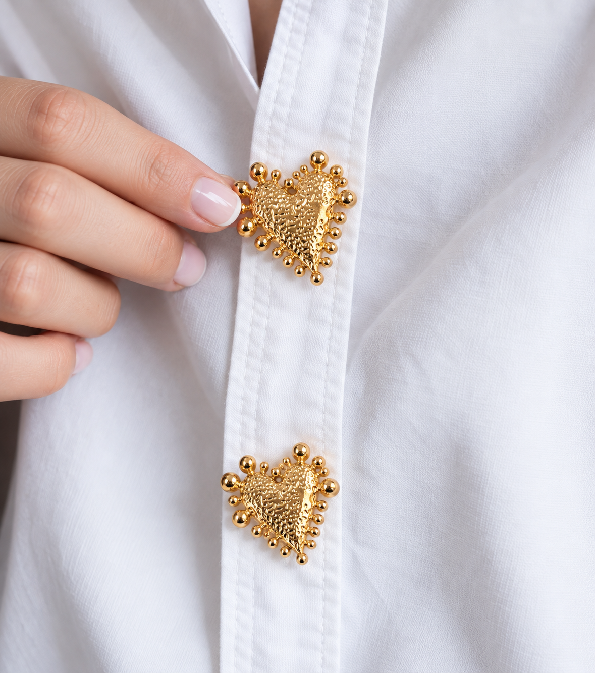 Golden heart-shaped button cover