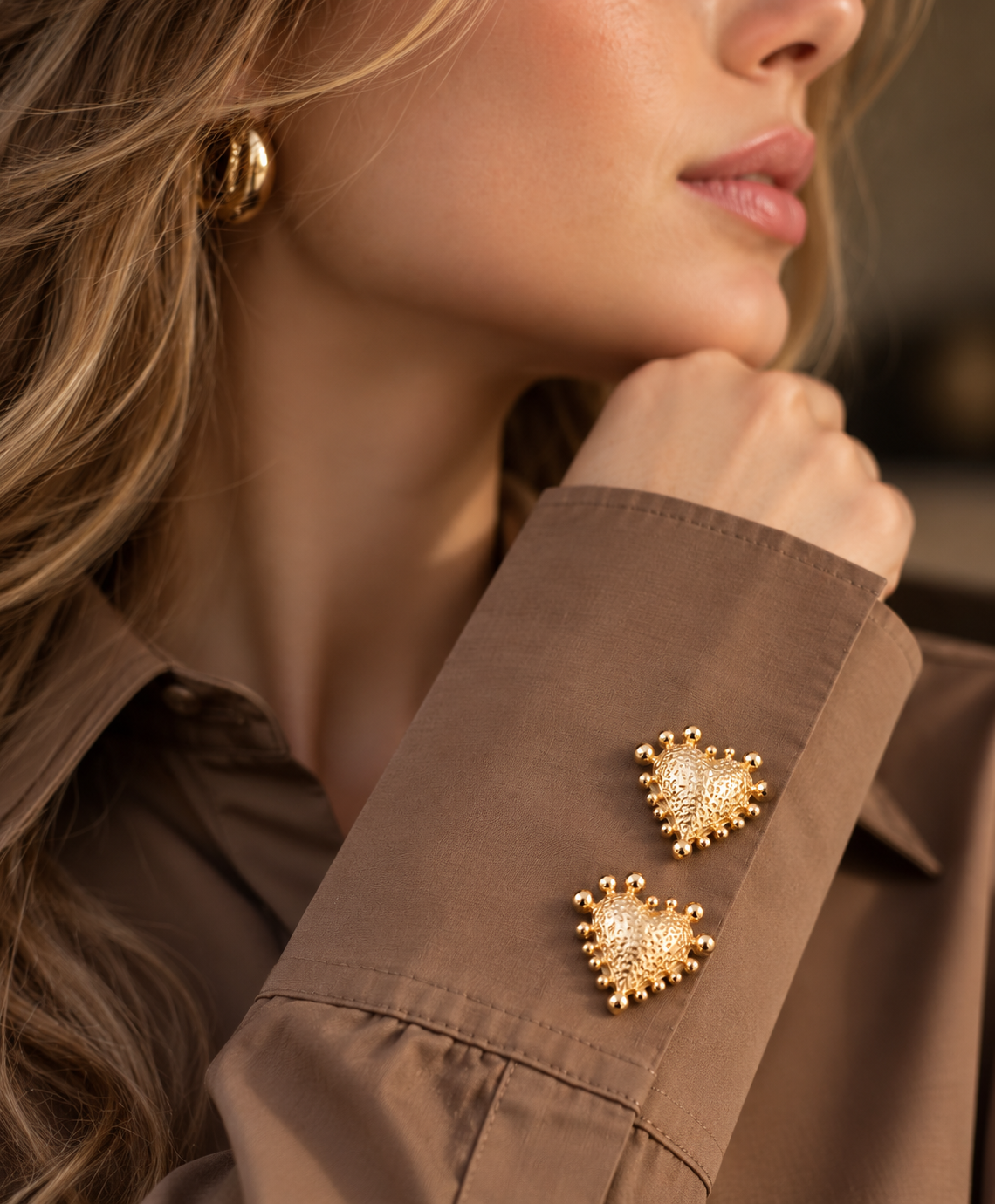 Golden heart-shaped button cover
