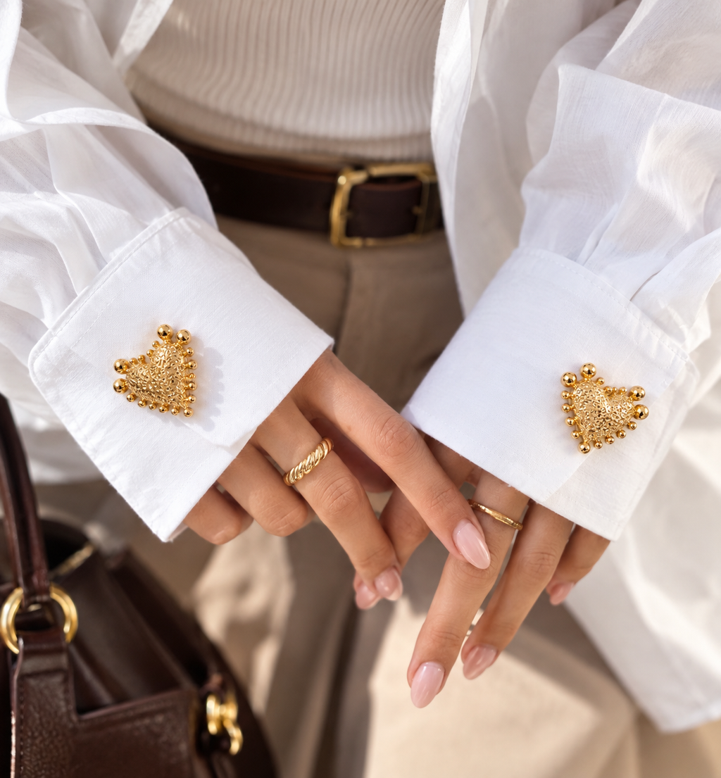 Golden heart-shaped button cover